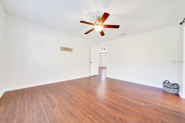 6142 SE 37th Ter, Ocala, FL 34480 - spare room with ceiling fan, wood finished floors, and a chandelier