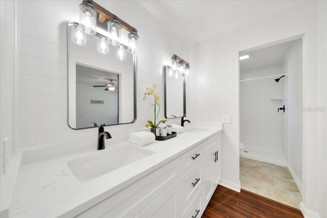 6142 SE 37th Ter, Ocala, FL 34480 - full bath featuring double vanity, tiled shower, wood finished floors, and ceiling fan