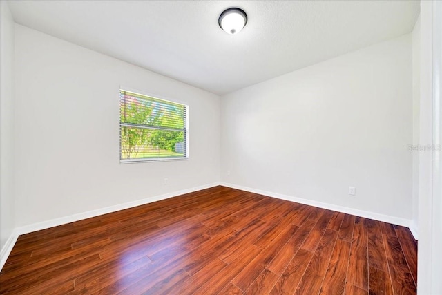 6142 SE 37th Ter, Ocala, FL 34480 - unfurnished room with dark wood finished floors and baseboards