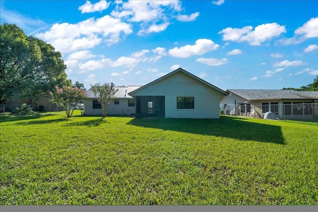 6142 SE 37th Ter, Ocala, FL 34480 - rear view of property featuring a metal roof