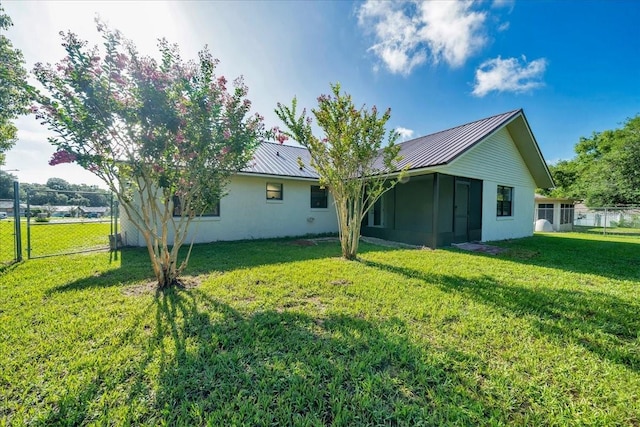 6142 SE 37th Ter, Ocala, FL 34480 - rear view of property with a metal roof and stucco siding