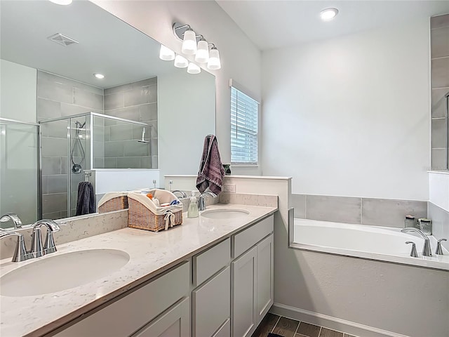 19424 SW 77th Loop, Dunnellon, FL 34432 - bathroom featuring double vanity, a stall shower, a bath, and wood finished floors