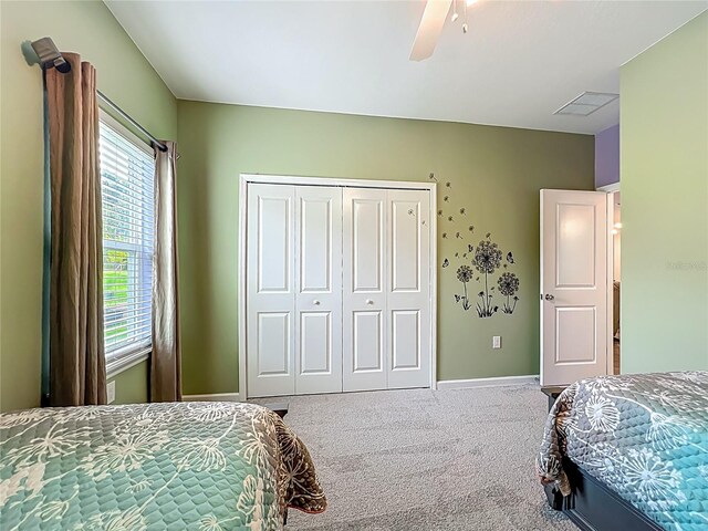 19424 SW 77th Loop, Dunnellon, FL 34432 - bedroom featuring carpet flooring, a closet, and a ceiling fan