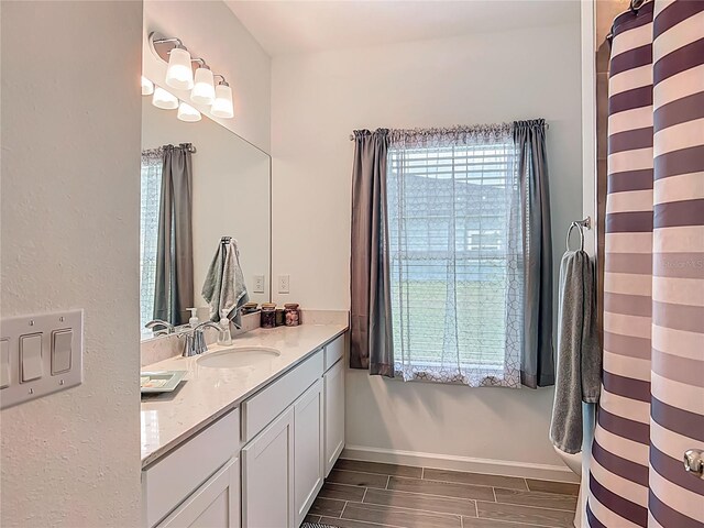 19424 SW 77th Loop, Dunnellon, FL 34432 - full bath with vanity and wood tiled floors