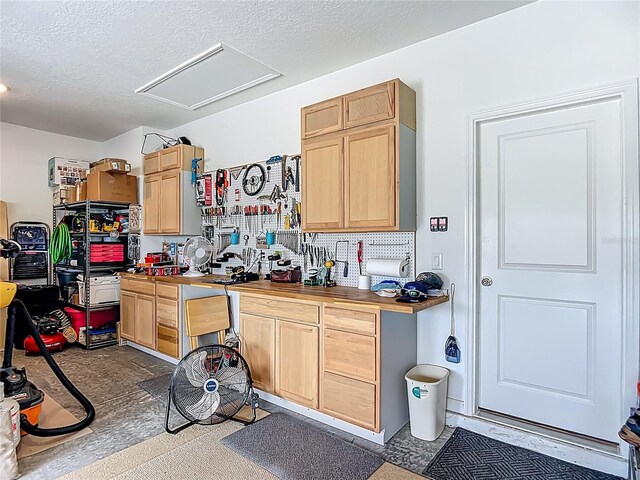 19424 SW 77th Loop, Dunnellon, FL 34432 - kitchen featuring light brown cabinetry and a textured ceiling