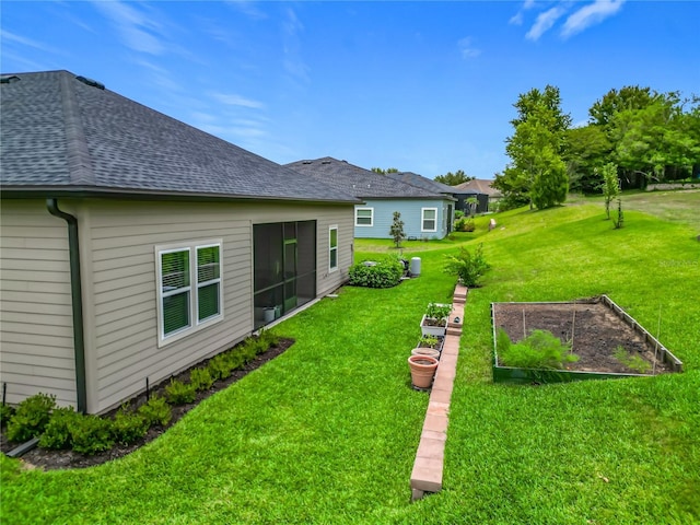 19424 SW 77th Loop, Dunnellon, FL 34432 - view of green lawn with a vegetable garden