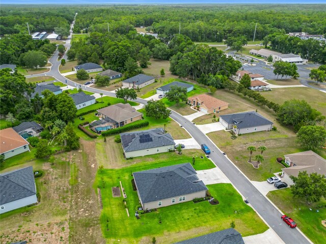 19424 SW 77th Loop, Dunnellon, FL 34432 - aerial perspective of suburban area featuring a heavily wooded area