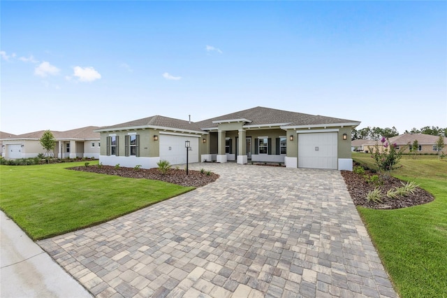 10561 SW 98th Pl, Ocala, FL 34481 - view of front of home featuring a garage, stucco siding, decorative driveway, a front yard, and roof with shingles