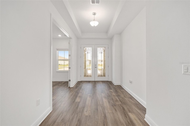 10561 SW 98th Pl, Ocala, FL 34481 - entryway featuring french doors, wood finished floors, and a raised ceiling