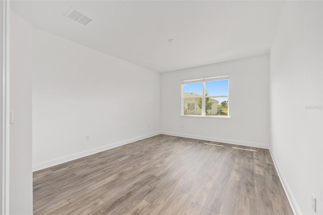 10561 SW 98th Pl, Ocala, FL 34481 - empty room featuring light wood-style floors and baseboards