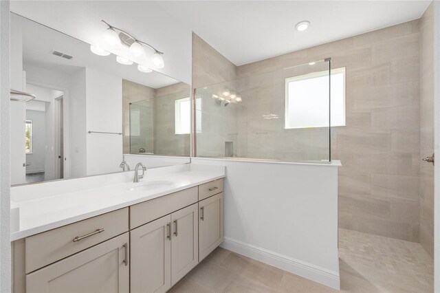 10561 SW 98th Pl, Ocala, FL 34481 - full bathroom featuring a walk in shower, vanity, and tile patterned floors