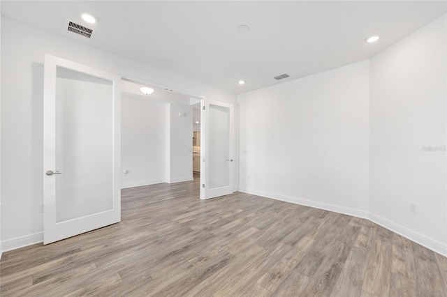 10561 SW 98th Pl, Ocala, FL 34481 - empty room with light wood-type flooring and recessed lighting