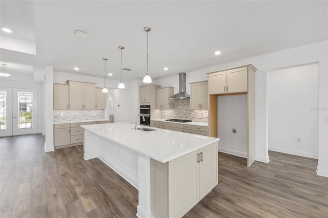 10561 SW 98th Pl, Ocala, FL 34481 - kitchen featuring wall chimney exhaust hood, stainless steel gas cooktop, dark wood-type flooring, tasteful backsplash, and recessed lighting