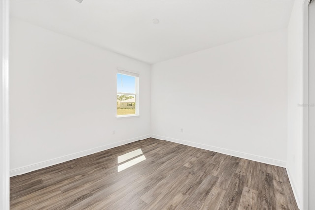 10561 SW 98th Pl, Ocala, FL 34481 - spare room with wood finished floors and baseboards