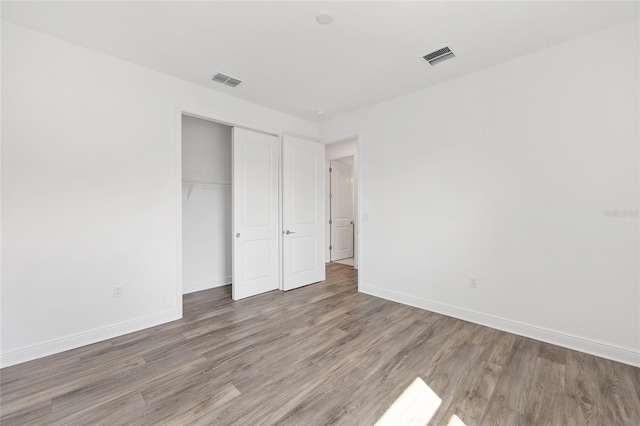 10561 SW 98th Pl, Ocala, FL 34481 - unfurnished bedroom featuring wood finished floors and a closet