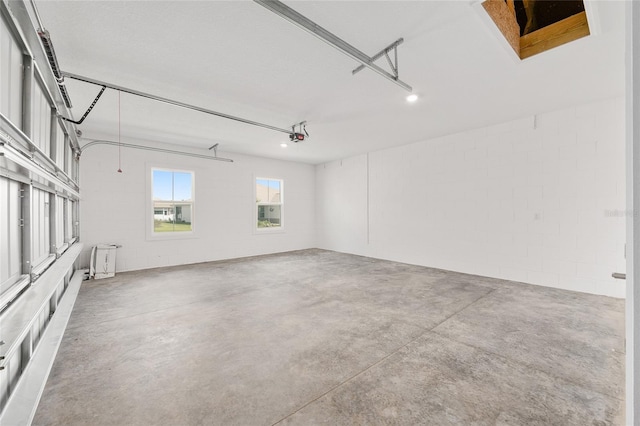 10561 SW 98th Pl, Ocala, FL 34481 - garage featuring concrete block wall and a garage door opener