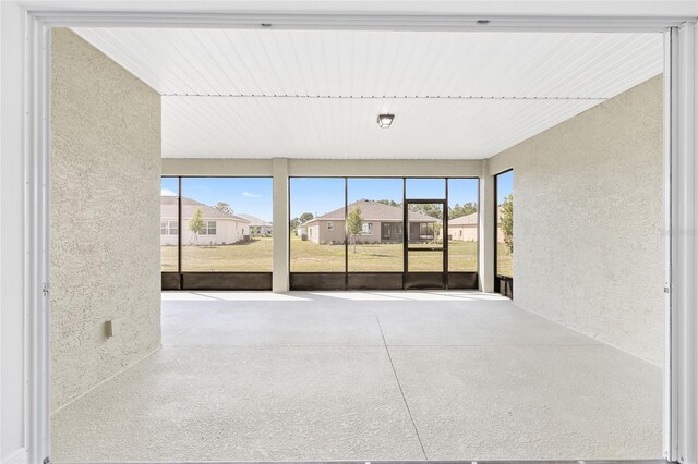 10561 SW 98th Pl, Ocala, FL 34481 - unfurnished sunroom featuring a residential view and plenty of natural light