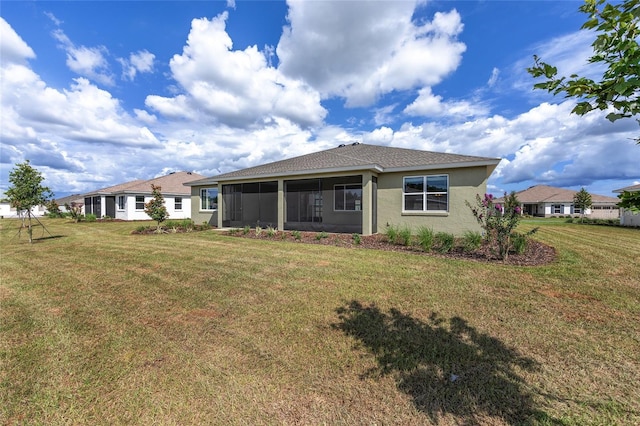 10561 SW 98th Pl, Ocala, FL 34481 - rear view of property featuring stucco siding, a yard, and a sunroom