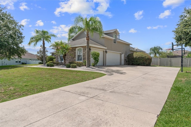4731 SE 34th St, Ocala, FL 34480 - view of front of house featuring concrete driveway, stone siding, stucco siding, a garage, and a gate