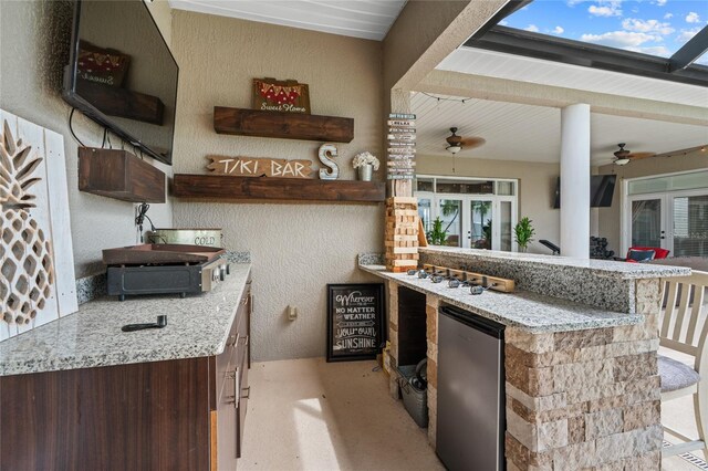 4731 SE 34th St, Ocala, FL 34480 - view of patio / terrace with ceiling fan, french doors, and an outdoor kitchen