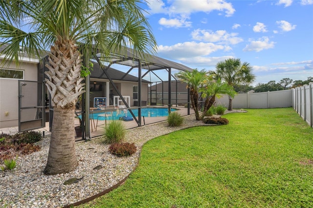 4731 SE 34th St, Ocala, FL 34480 - view of pool with a fenced backyard, glass enclosure, and a patio