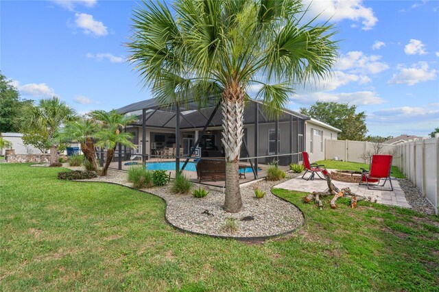 4731 SE 34th St, Ocala, FL 34480 - rear view of house featuring an outdoor fire pit, a patio, a fenced backyard, and a lanai