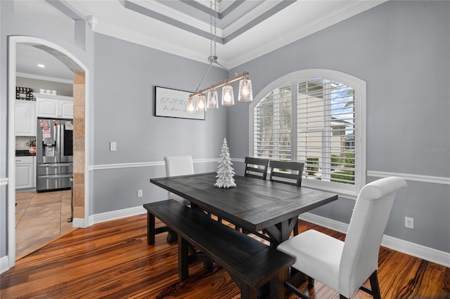 4731 SE 34th St, Ocala, FL 34480 - dining area featuring arched walkways, ornamental molding, light wood finished floors, and a chandelier