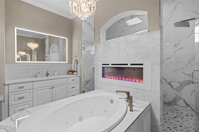 4731 SE 34th St, Ocala, FL 34480 - bathroom with a chandelier, a marble finish shower, a tub with jets, vanity, and crown molding