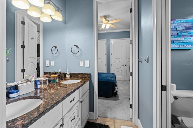 4731 SE 34th St, Ocala, FL 34480 - full bath featuring ornamental molding, double vanity, a ceiling fan, and tile patterned floors