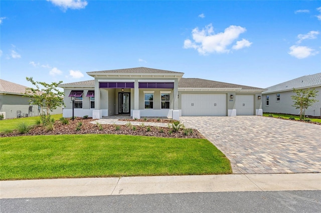 10026 SW 85th Place Rd, Ocala, FL 34481 - view of front of property with stucco siding, an attached garage, and a front yard