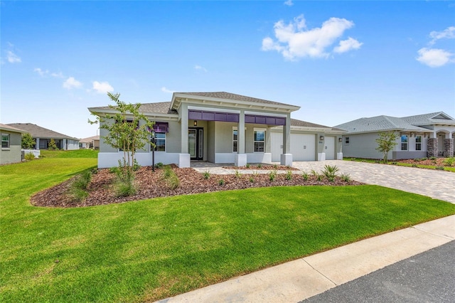 10026 SW 85th Place Rd, Ocala, FL 34481 - view of front facade featuring a garage, decorative driveway, stucco siding, a front lawn, and roof with shingles