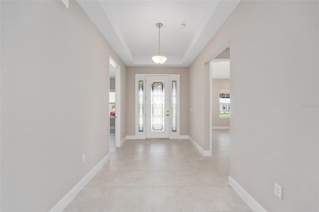 10026 SW 85th Place Rd, Ocala, FL 34481 - entrance foyer featuring light tile patterned floors and a raised ceiling