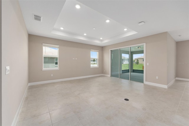 10026 SW 85th Place Rd, Ocala, FL 34481 - empty room with recessed lighting, a tray ceiling, and light tile patterned flooring