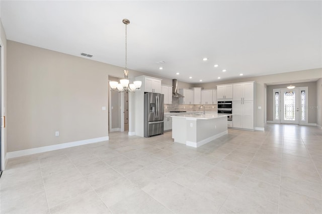 10026 SW 85th Place Rd, Ocala, FL 34481 - kitchen featuring stainless steel fridge, wall chimney exhaust hood, a chandelier, light countertops, and decorative backsplash