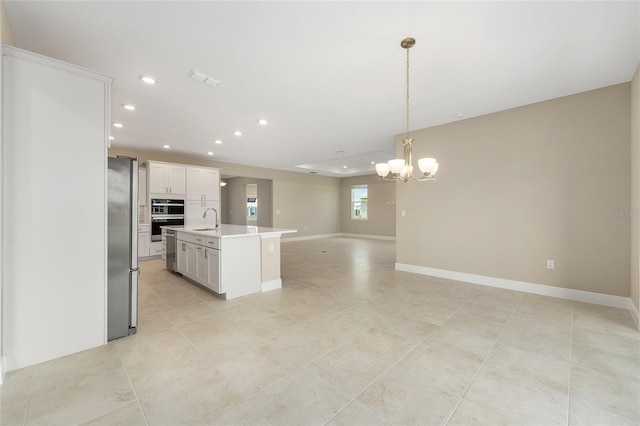 10026 SW 85th Place Rd, Ocala, FL 34481 - kitchen featuring appliances with stainless steel finishes, open floor plan, a chandelier, light countertops, and recessed lighting