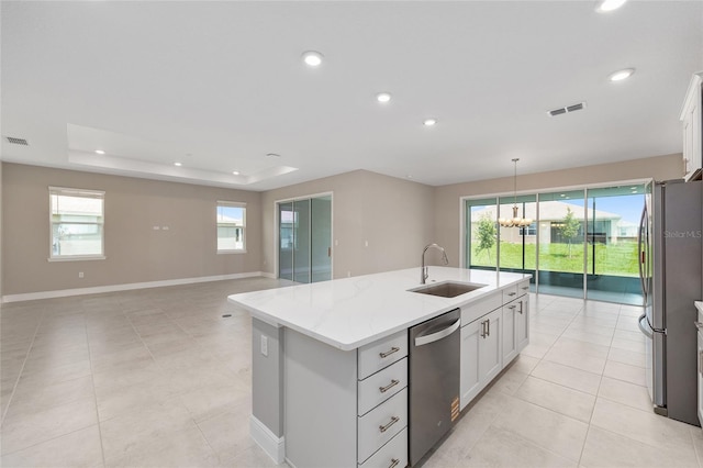 10026 SW 85th Place Rd, Ocala, FL 34481 - kitchen featuring stainless steel appliances, an island with sink, recessed lighting, white cabinets, and light stone counters