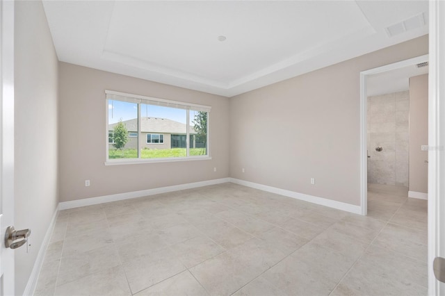 10026 SW 85th Place Rd, Ocala, FL 34481 - unfurnished room featuring a raised ceiling and light tile patterned floors