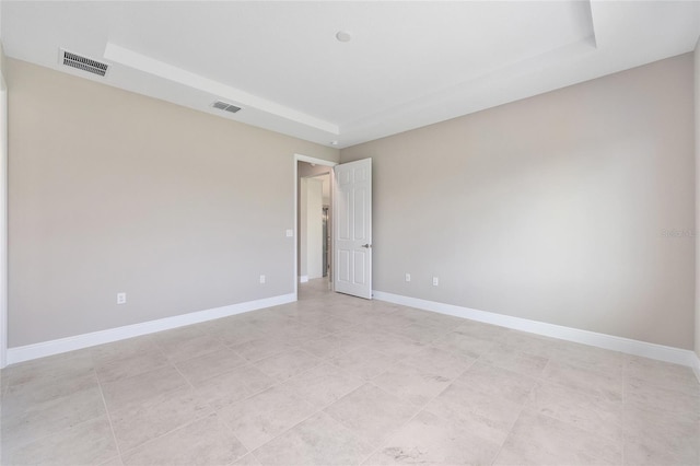 10026 SW 85th Place Rd, Ocala, FL 34481 - spare room featuring a tray ceiling and baseboards