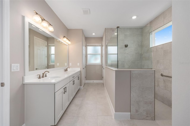 10026 SW 85th Place Rd, Ocala, FL 34481 - bathroom with a walk in shower, double vanity, and tile patterned flooring