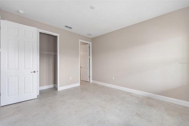 10026 SW 85th Place Rd, Ocala, FL 34481 - unfurnished bedroom featuring a closet and light tile patterned floors