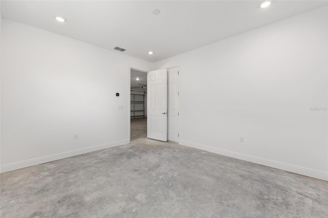 10026 SW 85th Place Rd, Ocala, FL 34481 - unfurnished bedroom with concrete flooring and recessed lighting