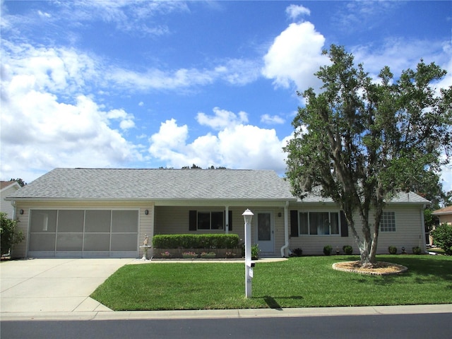 11470 SW 139th St, Dunnellon, FL 34432 - ranch-style house featuring driveway, a front lawn, a garage, and a shingled roof