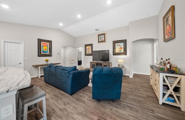 11330 SW 61st Cir, Ocala, FL 34476 - living area with arched walkways, vaulted ceiling, dark wood-type flooring, and recessed lighting