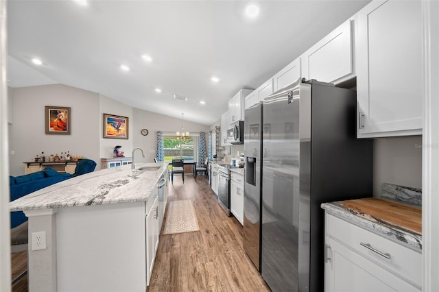 11330 SW 61st Cir, Ocala, FL 34476 - kitchen with stainless steel appliances, light wood-style floors, a kitchen island with sink, white cabinets, and recessed lighting