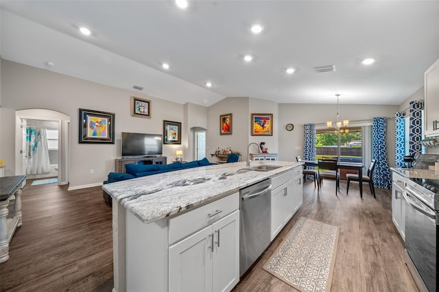 11330 SW 61st Cir, Ocala, FL 34476 - kitchen featuring dishwasher, arched walkways, lofted ceiling, open floor plan, and a kitchen island with sink