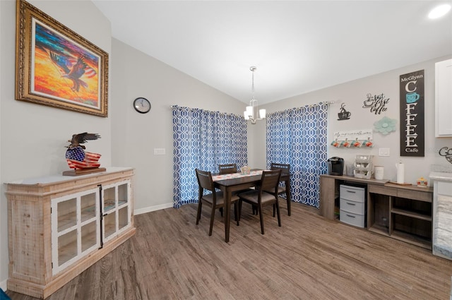 11330 SW 61st Cir, Ocala, FL 34476 - dining space with wood finished floors, lofted ceiling, and a chandelier