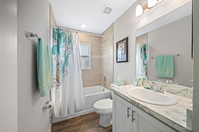 11330 SW 61st Cir, Ocala, FL 34476 - bathroom with vanity, shower / bath combo with shower curtain, and wood finished floors