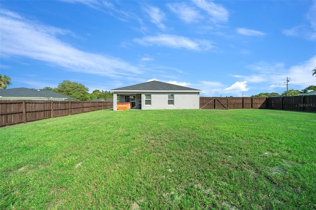 11330 SW 61st Cir, Ocala, FL 34476 - rear view of property featuring a fenced backyard and stucco siding