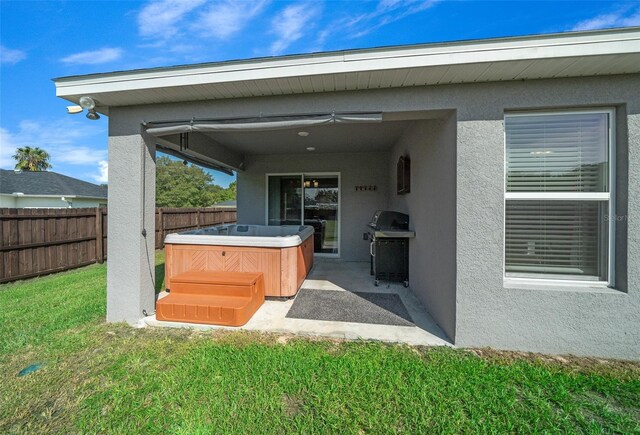 11330 SW 61st Cir, Ocala, FL 34476 - fenced backyard featuring a hot tub, a grill, and a patio
