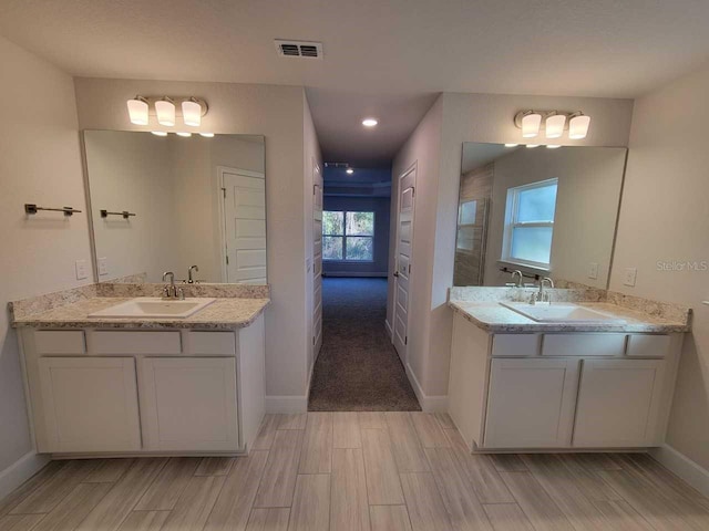 12384 SW 96th Ln, Dunnellon, FL 34432 - full bath with wood finish floors and two vanities